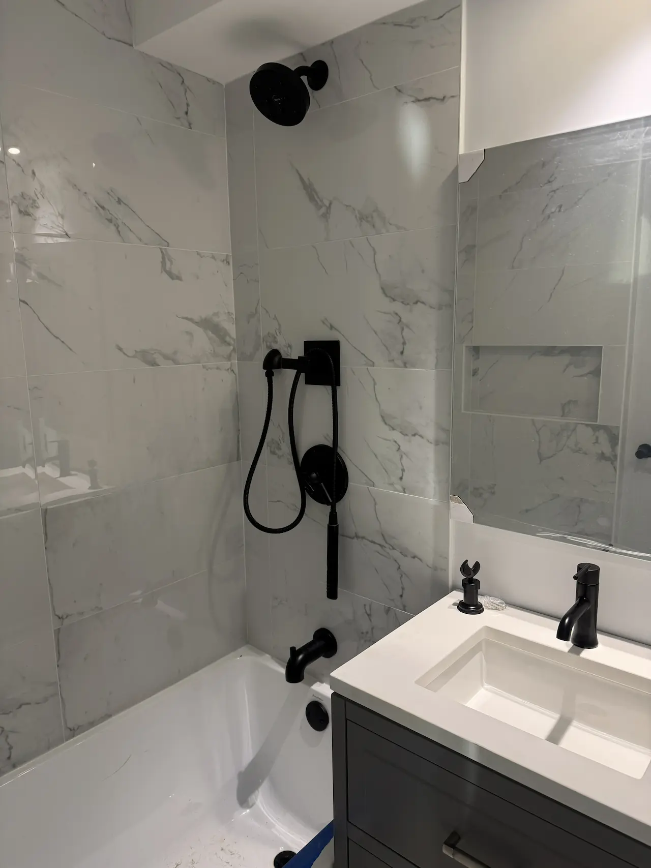 Shower niche and wall tiles with even grout — final result by ONIITO in NYC